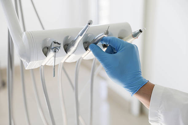 Professional Tooth Extraction technician working in Harris Hill, NY